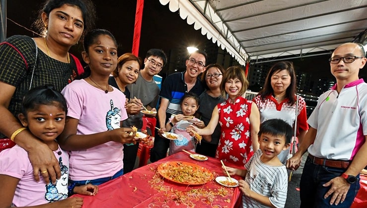 Families and members of the community get together for lo hei, a Prosperity Toss for Chinese New Year