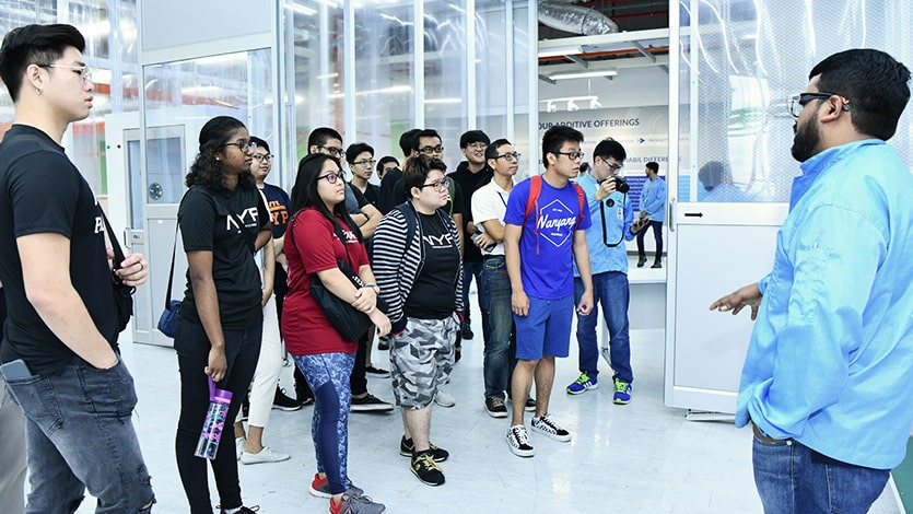 Students tour the smart factory of an electronics company