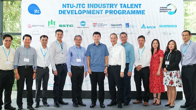 Senior Minister of State Mr Chee Hong Tat with programme partners from the NTU-JTC Industry Talent Development Programme