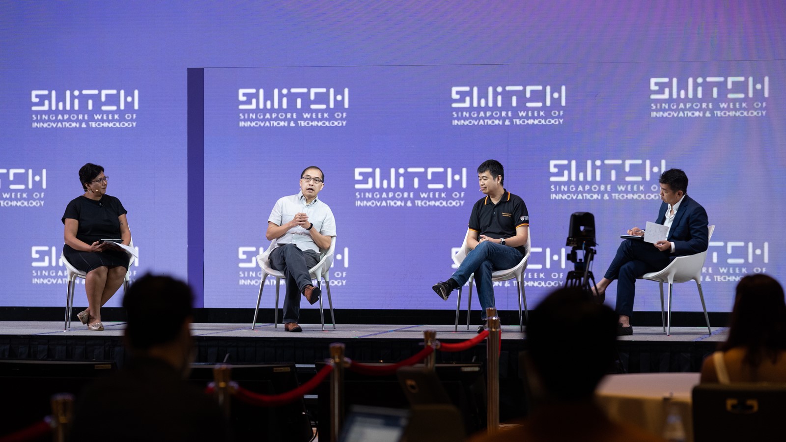 From left: Miss Sash Mukherjee moderating a panel discussion at the Singapore Week of Innovation and Technology, where Mr Tan Boon Khai, Dr David Woon, and Mr Alvin Ng shared their views on how smart districts will power innovation